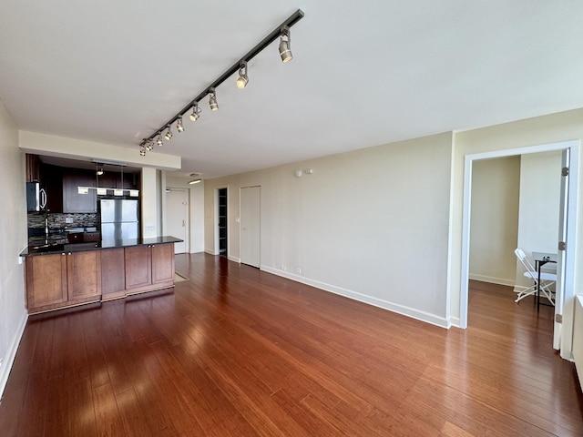 1850 N Clark St Unit 2706, Chicago, IL 60614 - unfurnished living room with rail lighting and dark wood finished floors
