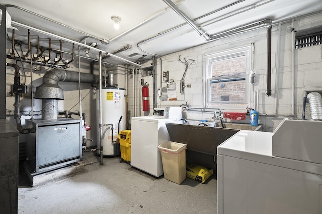 2730 N 74th Ct Unit Gw, Elmwood Park, IL 60707 - below grade area featuring gas water heater, washing machine and clothes dryer, and a heating unit