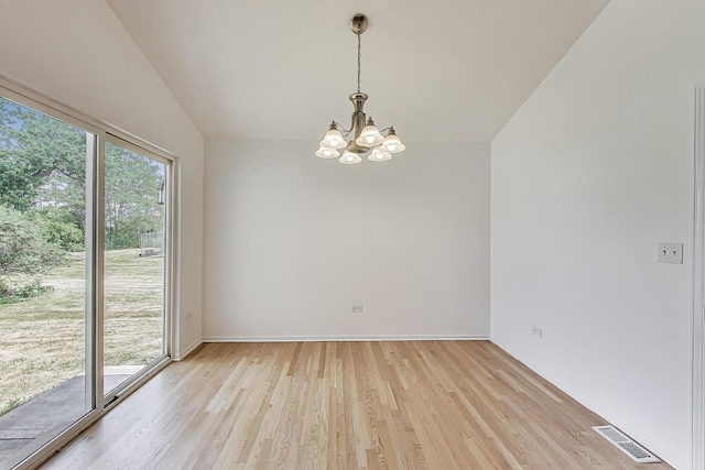 25651 S Middle Point Ave, Monee, IL 60449 - unfurnished room featuring a chandelier, light wood-type flooring, and vaulted ceiling