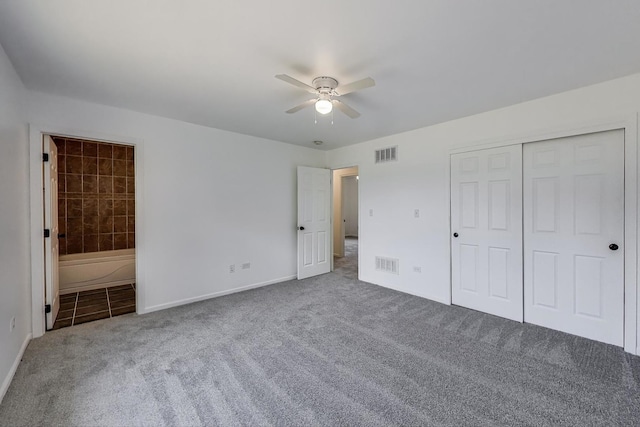 25651 S Middle Point Ave, Monee, IL 60449 - unfurnished bedroom featuring carpet flooring, connected bathroom, a closet, a ceiling fan, and tile patterned floors