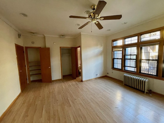 1127 W Farwell Ave Unit 106, Chicago, IL 60626 - unfurnished bedroom with radiator, light wood-style flooring, crown molding, and a closet