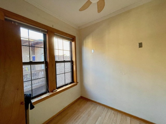 1127 W Farwell Ave Unit 106, Chicago, IL 60626 - spare room featuring light wood finished floors, healthy amount of natural light, ceiling fan, and crown molding