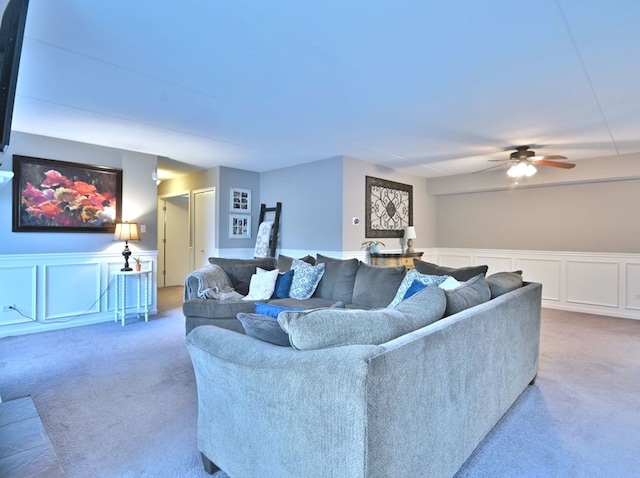 14031 Norwich Ln Unit 101, Orland Park, IL 60467 - carpeted living area featuring a decorative wall, a ceiling fan, and wainscoting