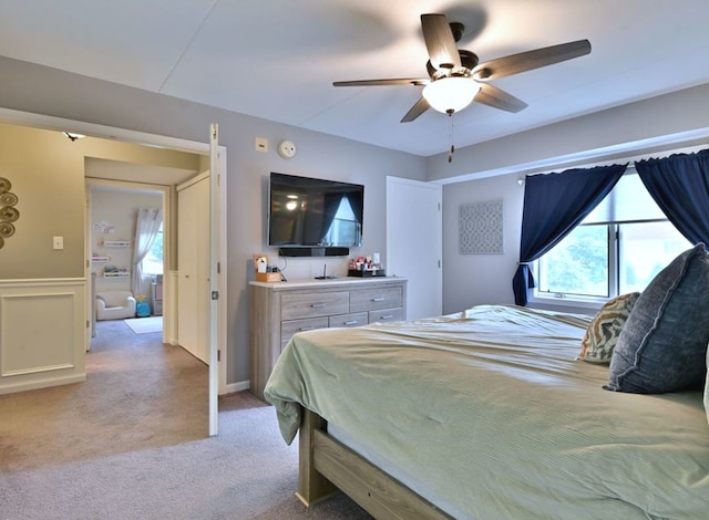 14031 Norwich Ln Unit 101, Orland Park, IL 60467 - bedroom with multiple windows, light colored carpet, wainscoting, and a ceiling fan