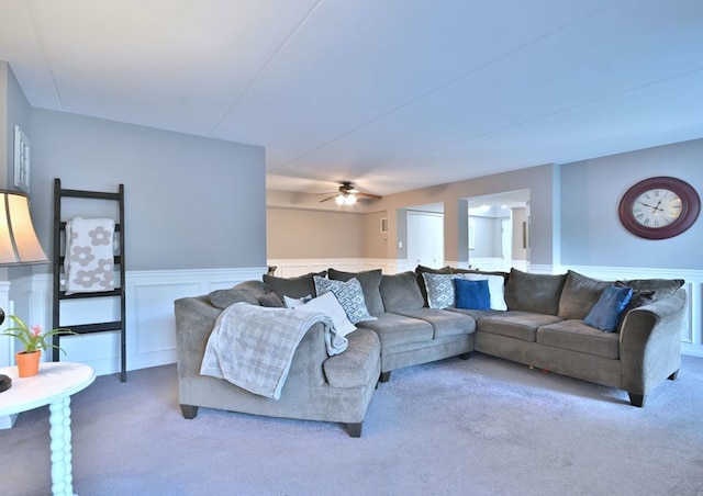 14031 Norwich Ln Unit 101, Orland Park, IL 60467 - living area featuring carpet, a wainscoted wall, and a ceiling fan