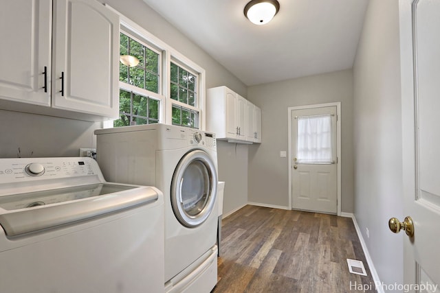 768 Wexford Ct, Grayslake, IL 60030 - washroom featuring washer and clothes dryer, cabinet space, and dark wood-type flooring