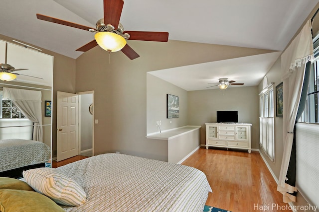 768 Wexford Ct, Grayslake, IL 60030 - bedroom featuring wood finished floors, multiple windows, high vaulted ceiling, and ceiling fan