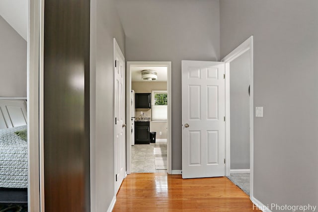768 Wexford Ct, Grayslake, IL 60030 - corridor featuring light wood-style flooring and baseboards
