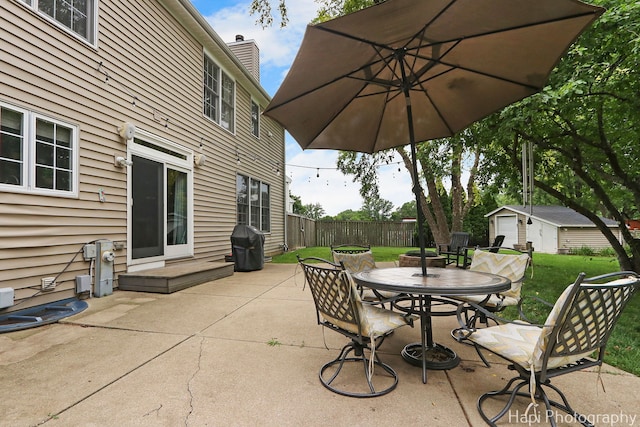 768 Wexford Ct, Grayslake, IL 60030 - view of patio with outdoor dining space, a grill, and an outdoor structure