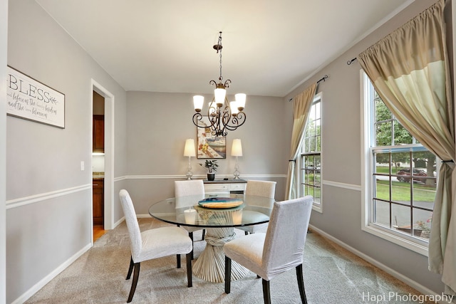 768 Wexford Ct, Grayslake, IL 60030 - dining area with light colored carpet and a chandelier