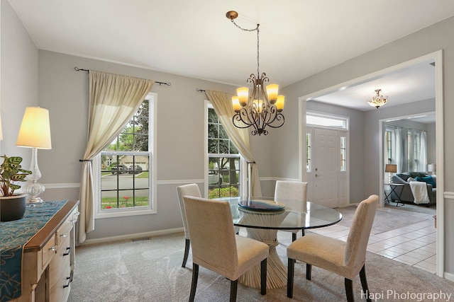768 Wexford Ct, Grayslake, IL 60030 - dining space featuring a chandelier, light colored carpet, and light tile patterned floors