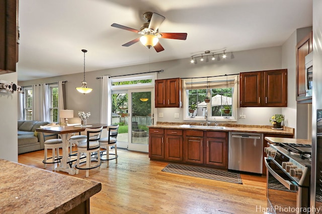 768 Wexford Ct, Grayslake, IL 60030 - kitchen with appliances with stainless steel finishes, healthy amount of natural light, ceiling fan, and light wood finished floors