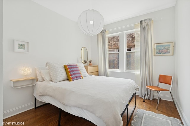 3555 W Lyndale St Unit 3B, Chicago, IL 60647 - bedroom featuring baseboards and wood finished floors