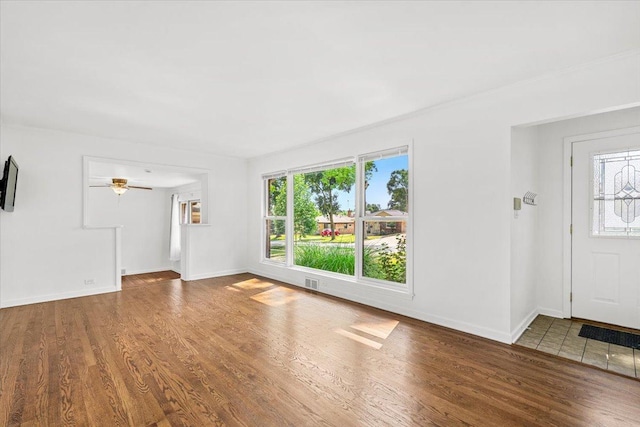 115 S Hale St, Palatine, IL 60067 - unfurnished living room featuring healthy amount of natural light and wood finished floors