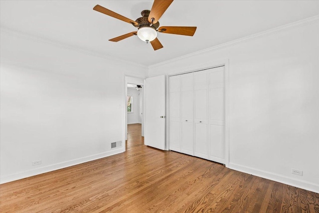 115 S Hale St, Palatine, IL 60067 - unfurnished bedroom featuring wood finished floors, ornamental molding, a closet, and a ceiling fan