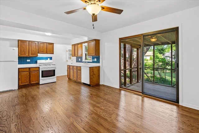 115 S Hale St, Palatine, IL 60067 - kitchen featuring white appliances, light countertops, brown cabinetry, and tasteful backsplash
