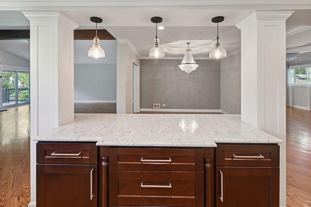129 Kainer Ave, Barrington, IL 60010 - kitchen with wood finished floors, ornate columns, light stone counters, crown molding, and pendant lighting
