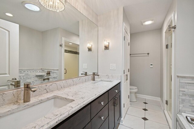 129 Kainer Ave, Barrington, IL 60010 - full bathroom with double vanity, tile patterned floors, and recessed lighting