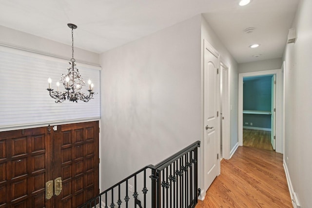 129 Kainer Ave, Barrington, IL 60010 - corridor featuring light wood-type flooring, a chandelier, recessed lighting, and an upstairs landing