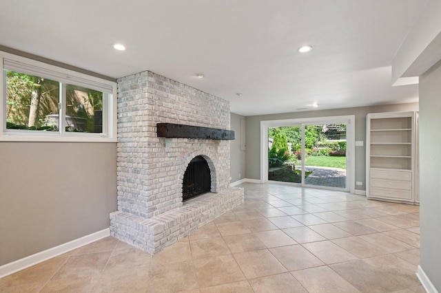 129 Kainer Ave, Barrington, IL 60010 - unfurnished living room featuring a brick fireplace, light tile patterned floors, and recessed lighting