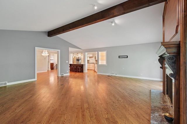 129 Kainer Ave, Barrington, IL 60010 - unfurnished living room with a brick fireplace and wood finished floors
