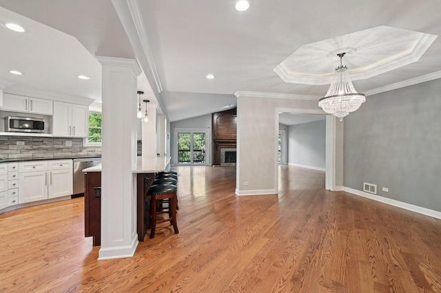 129 Kainer Ave, Barrington, IL 60010 - dining area featuring a chandelier, light wood-style flooring, recessed lighting, a fireplace, and crown molding