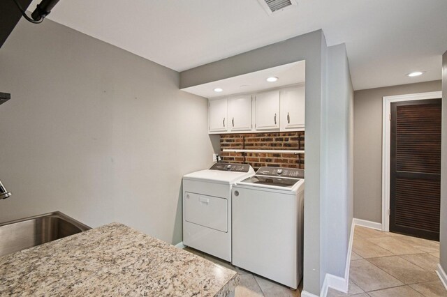 129 Kainer Ave, Barrington, IL 60010 - laundry room with washer and dryer, cabinet space, light tile patterned floors, and recessed lighting