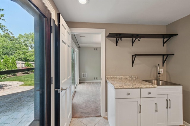 129 Kainer Ave, Barrington, IL 60010 - interior space featuring open shelves, white cabinets, light tile patterned flooring, and light colored carpet
