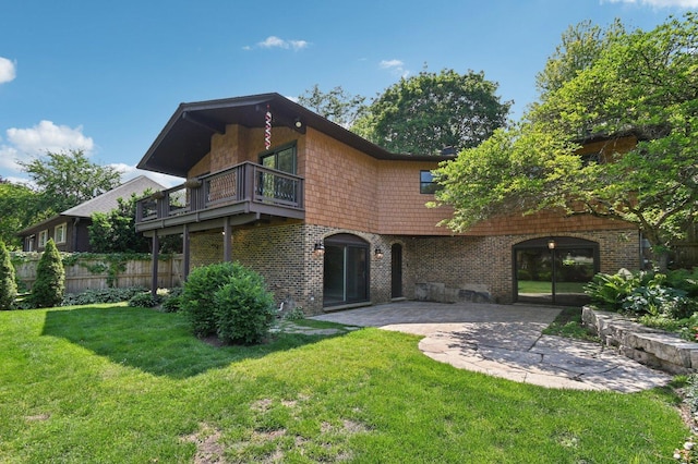 129 Kainer Ave, Barrington, IL 60010 - back of property with a balcony, brick siding, and a patio area