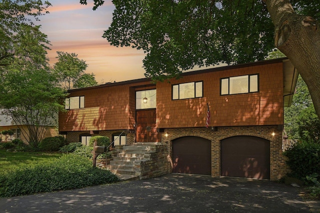 129 Kainer Ave, Barrington, IL 60010 - raised ranch with a garage, brick siding, and asphalt driveway