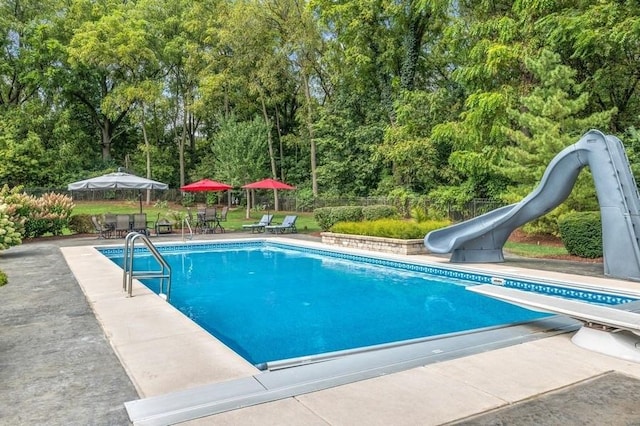 41W590 Bowgren Dr, Campton Hills, IL 60119 - swimming pool with a water slide, a patio, and view of scattered trees