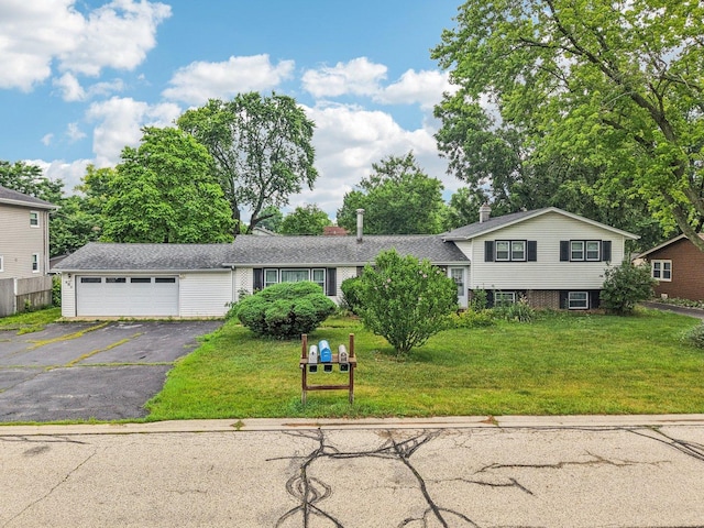 602 Daisy Ln, Round Lake Beach, IL 60073 - tri-level home featuring driveway, a front yard, and an attached garage