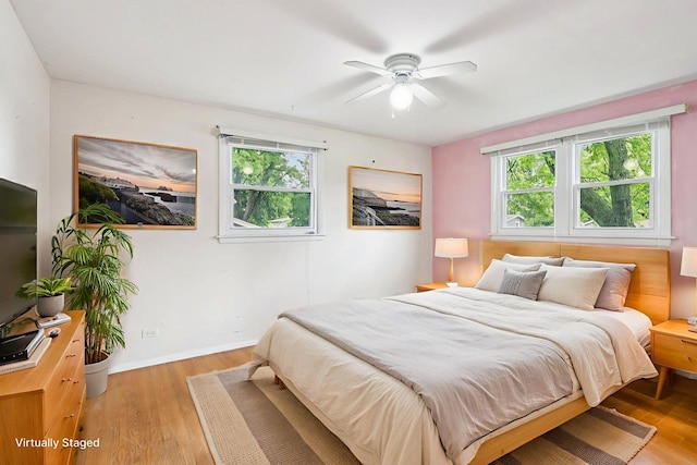602 Daisy Ln, Round Lake Beach, IL 60073 - bedroom featuring light wood-type flooring and ceiling fan