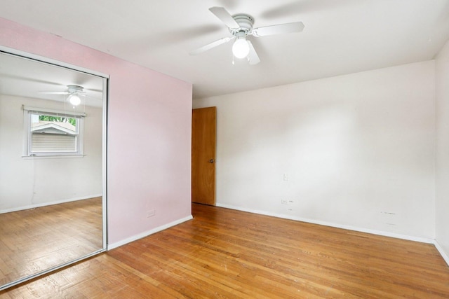 602 Daisy Ln, Round Lake Beach, IL 60073 - unfurnished bedroom with a closet, light wood finished floors, and ceiling fan