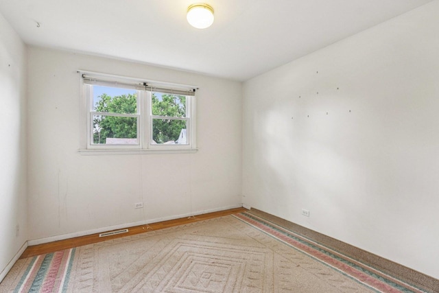 602 Daisy Ln, Round Lake Beach, IL 60073 - empty room featuring wood finished floors and baseboards