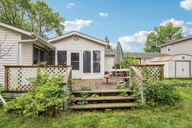 602 Daisy Ln, Round Lake Beach, IL 60073 - back of house featuring a shed, a wooden deck, and a sunroom
