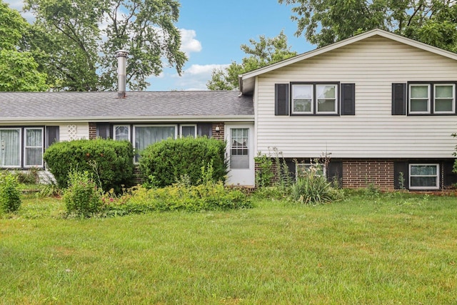 602 Daisy Ln, Round Lake Beach, IL 60073 - split level home featuring a front yard, brick siding, and roof with shingles