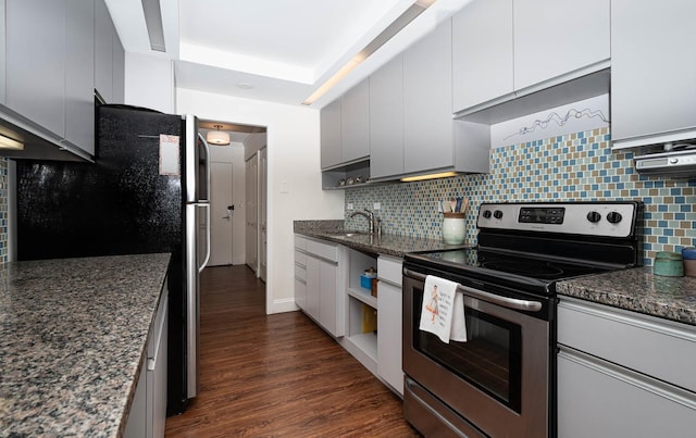 5455 N Sheridan Rd Unit 3512, Chicago, IL 60640 - kitchen with appliances with stainless steel finishes, decorative backsplash, dark wood finished floors, dark stone counters, and a raised ceiling