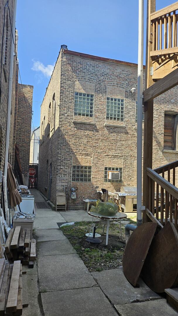 2536 S Avers Ave, Chicago, IL 60623 - view of side of home with brick siding and a patio