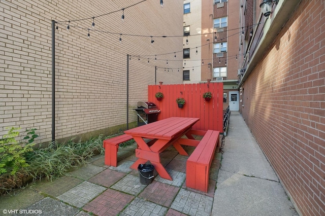 5950 N Kenmore Ave Unit 306, Chicago, IL 60660 - view of patio featuring outdoor dining space and grilling area