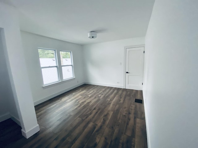 411 W 116th St, Chicago, IL 60628 - spare room featuring dark wood-style floors