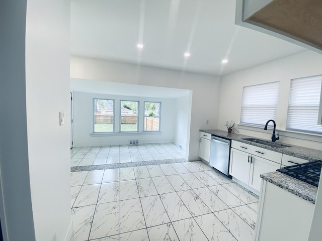 411 W 116th St, Chicago, IL 60628 - kitchen featuring dishwasher, light marble finish flooring, white cabinetry, recessed lighting, and dark stone counters