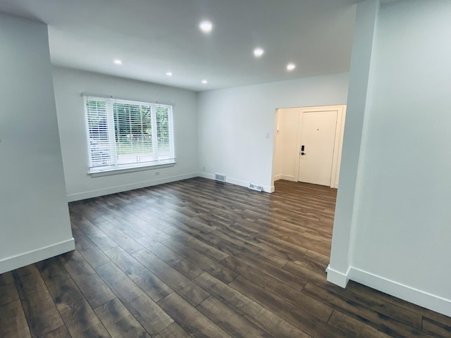 411 W 116th St, Chicago, IL 60628 - unfurnished room with recessed lighting and dark wood-type flooring
