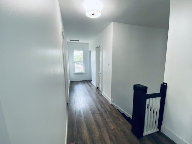 411 W 116th St, Chicago, IL 60628 - corridor featuring dark wood finished floors and an upstairs landing