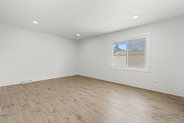 154 Newton Ave, Glen Ellyn, IL 60137 - spare room with wood finished floors and recessed lighting
