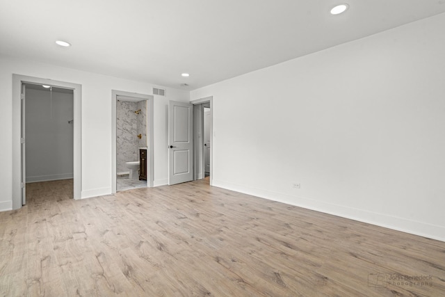 154 Newton Ave, Glen Ellyn, IL 60137 - unfurnished bedroom with a spacious closet, light wood-style floors, recessed lighting, and connected bathroom