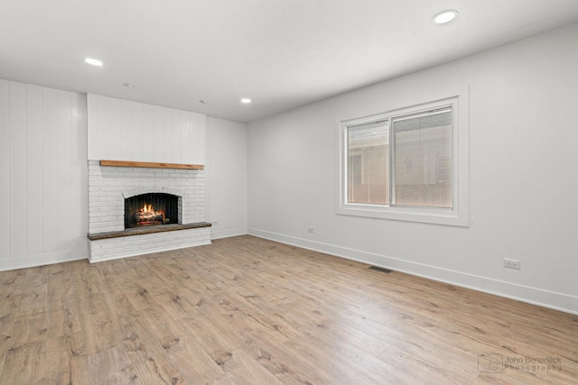 154 Newton Ave, Glen Ellyn, IL 60137 - unfurnished living room featuring light wood-type flooring, a fireplace, and recessed lighting