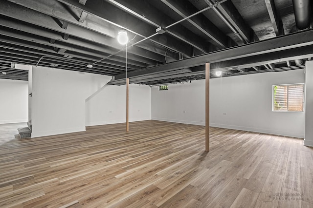 154 Newton Ave, Glen Ellyn, IL 60137 - below grade area featuring wood finished floors and stairway