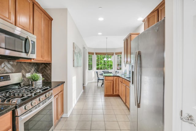 6406 Cunningham Ct, Gurnee, IL 60031 - kitchen with stainless steel appliances, decorative backsplash, dark stone counters, recessed lighting, and brown cabinets