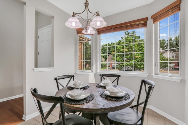 6406 Cunningham Ct, Gurnee, IL 60031 - dining area featuring a chandelier and light tile patterned floors